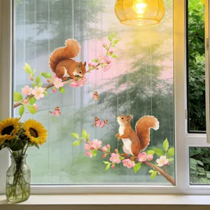 Watercolor squirrel and peach blossom branch stickers displayed on a home window