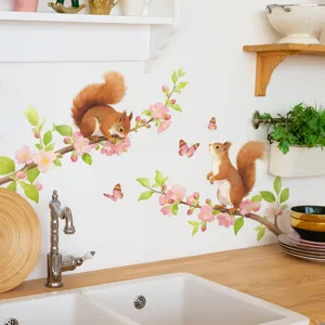 Watercolor squirrel and peach blossom wall stickers shown in a cozy kitchen setting