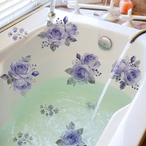Detail of purple rose floral wall stickers applied to a white bathtub interior