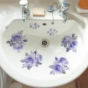 Purple rose floral decals applied on a white bathroom sink for home decoration