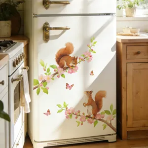 Detail view of artistic watercolor squirrel and peach blossom decals applied on refrigerator