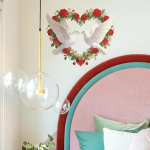 Detail view of heart rose wreath wall sticker with doves in a cozy bedroom setting