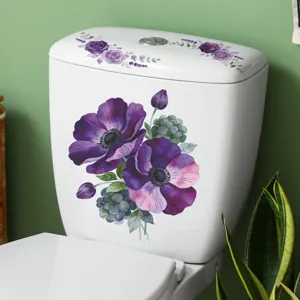 Detail view showing purple anemone and rose flower decals on a white toilet tank