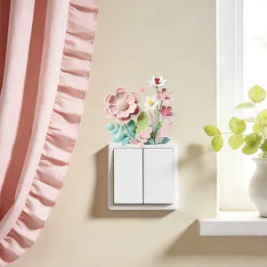 Gedetailleerd beeld van een macaron bloemenmuursticker op een witte standaard lichtschakelaar