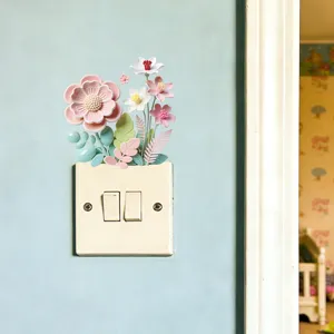 Detail van decoratieve pastel macaron bloemen muurstickers boven een schakelaar