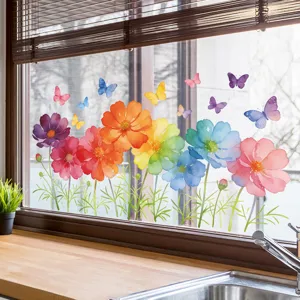 Detailed view of colorful watercolor cosmos flower window stickers on a glass window