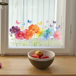 Close-up of watercolor gradient cosmos flower and butterfly stickers on a glass window