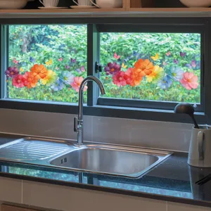 Detail of vibrant gradient cosmos flower and butterfly stickers on a kitchen window.