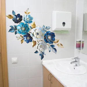 Blue enamel-style floral wall sticker applied on a white tiled bathroom wall décor