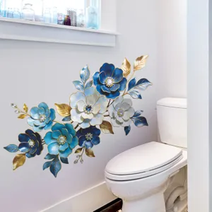 Elegant blue and gold enamel style floral wall sticker applied on a white bathroom wall
