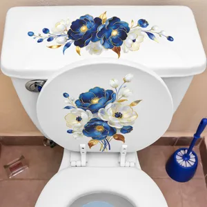 Elegant blue and white floral decals applied on a white toilet lid and tank