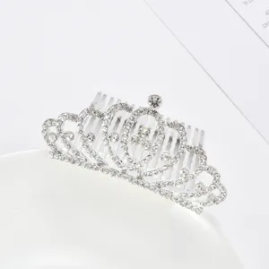 Close-up of silver tiara hair comb with sparkling rhinestones for kids.