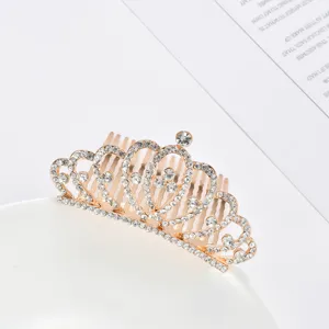 Detailed shot of an elegant gold tiara hair comb with sparkling clear rhinestones