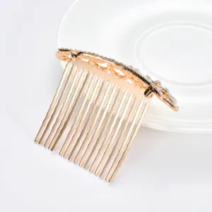 Detail view of golden rhinestone princess crown hair comb for kids fashion accessories.
