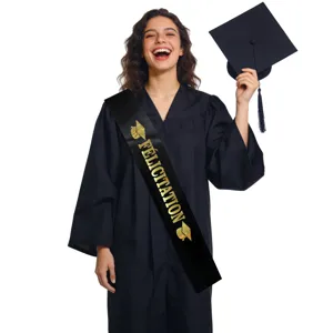 Black graduation sash with gold Félicitation text and gown set shown on model