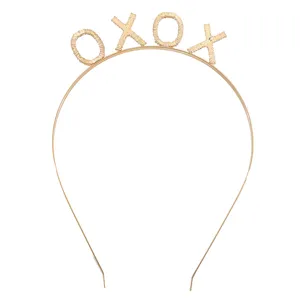 Detailed macro view of the gold-tone XOXO textured headband for Valentine's Day parties