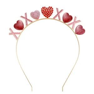 Close-up view showing glitter hearts and XOXO letters on golden Valentine's Day headband
