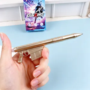 Creative gun shape gel pen detail showing metallic gold body and magazine push mechanism.