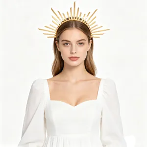 Elegant gold sun goddess headband halo crown worn by model on white background