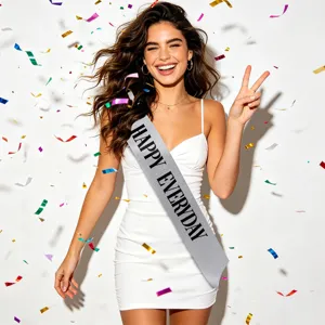 A silver glitter Happy Everyday party sash worn by a smiling model in a celebration