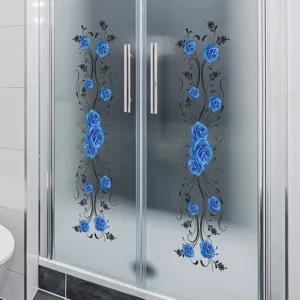 Close-up detail of elegant blue rose decorative stickers applied on a glass shower door surface