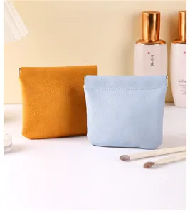 Mini portable leather makeup pouch with automatic closure design, ideal for carrying small items.