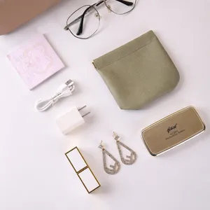 Portable waterproof PU leather storage pouch with auto-close design for cosmetics.