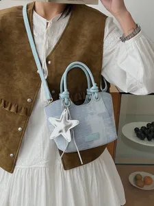 Stylish Korean style denim blue bucket bag featuring a silver star charm and shoulder strap