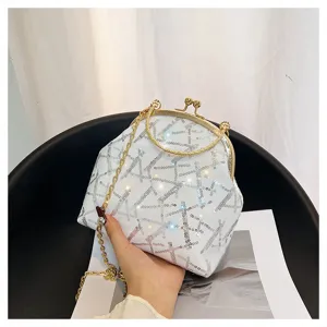 Close-up detail of a stylish white sequined shell bag with a gold chain strap and clip buckle.