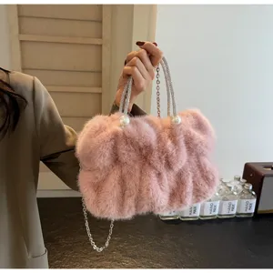 Pink faux fur handbag with pearl accents and rhinestone handle