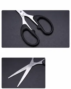 Stainless steel scissors detail view showing ergonomic handle and sharp durable blade.