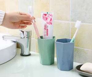 Detail shot of wheat straw geometric toothbrush cup in bathroom setting, durable rinse mug.