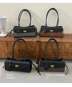 Korean style quilted baguette bags in multiple colors shown on a rustic wooden stand.