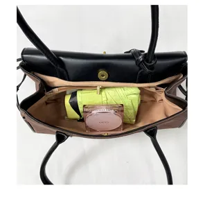 Interior detail of quilted baguette shoulder bag showing spacious storage capacity