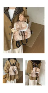 Close-up view of fluffy faux fur backpack featuring delicate lace trim and a cute bear charm