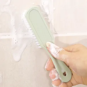 Multifunctional cleaning brush with soft bristles for shoes, clothes and bathroom use.