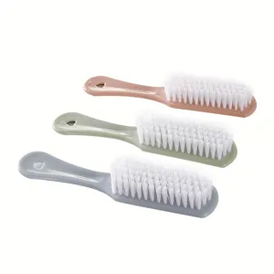 Multi-functional household cleaning brushes set with soft white bristles and colorful handles.