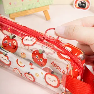 Transparent PVC pencil case with cute apple print and red zipper for students daily use.