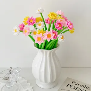 Silicone lotus-shaped gel pens creatively arranged in a decorative white ceramic vase