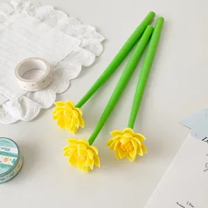 Macro detail of three creative silicone gel pens featuring yellow lotus flower toppers