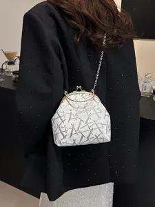 Elegant sequined shell bag with gold-tone kiss-lock and chain strap