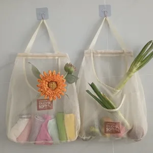 Hanging mesh storage bag detail showing breathable fabric and convenient open pocket design.