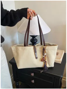 Bolso tote de lona con correas de cuero y borla elegante para el uso diario de oficina