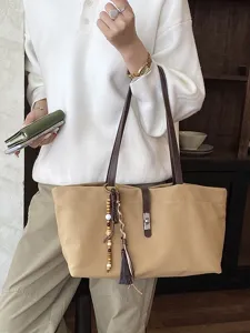 Bolso tote grande de lona con correas de cuero marrón y borla decorativa para el trabajo