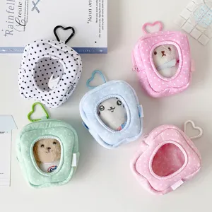 Assorted plush doll display storage pouches in pastel colors with heart carabiners