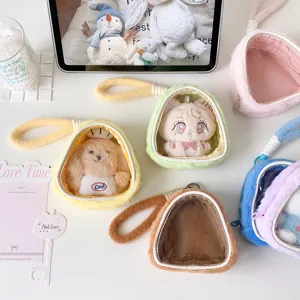 Detailed look at various colorful plush doll display bags featuring clear windows and handles.