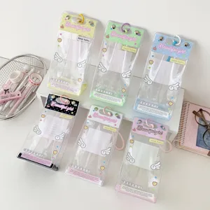 Close-up view of colorful transparent doll display bags with white angel wing prints