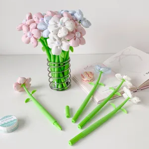 Detailed view of soft fabric flower pens with pearlescent center and green stem