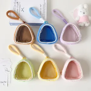 Detailed view of six colorful plush doll display bags with transparent windows for storage.