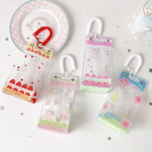 Close-up of four transparent PVC doll display bags with cute cake and fruit patterns